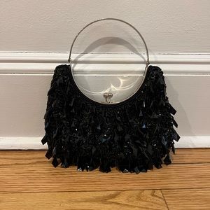 Black beaded evening bag with metal ring.